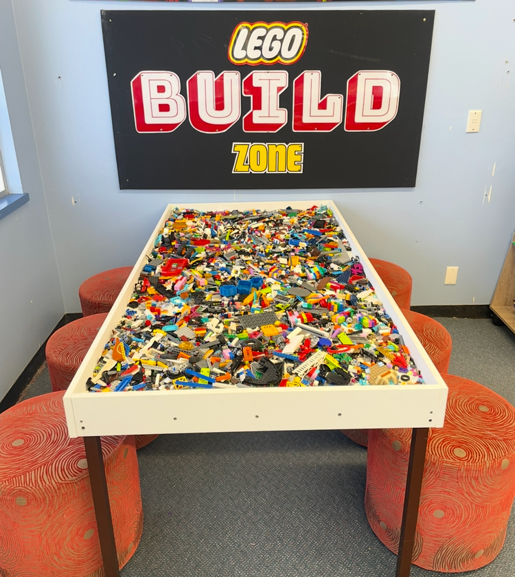 Lego table filled with lego for building