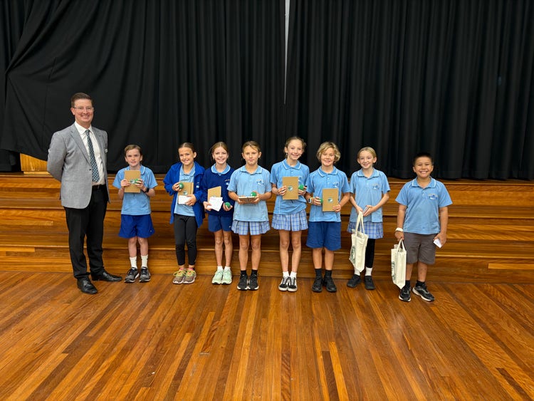 Students receiving awards from the High School Princia;